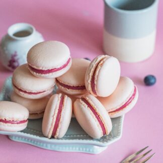 Pink macarons on a blue plate