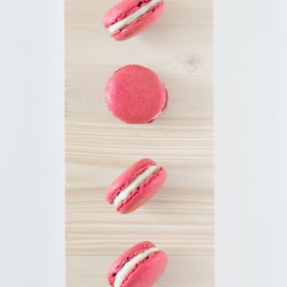 Cherry macarons laid on their side